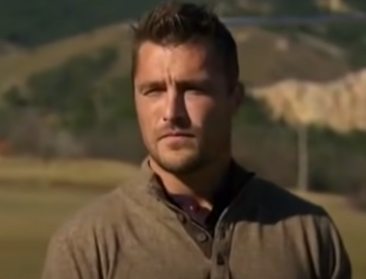 Screenshot:  Chris Soules is standing outside and looking at side - from The Bachelor (American TV series)