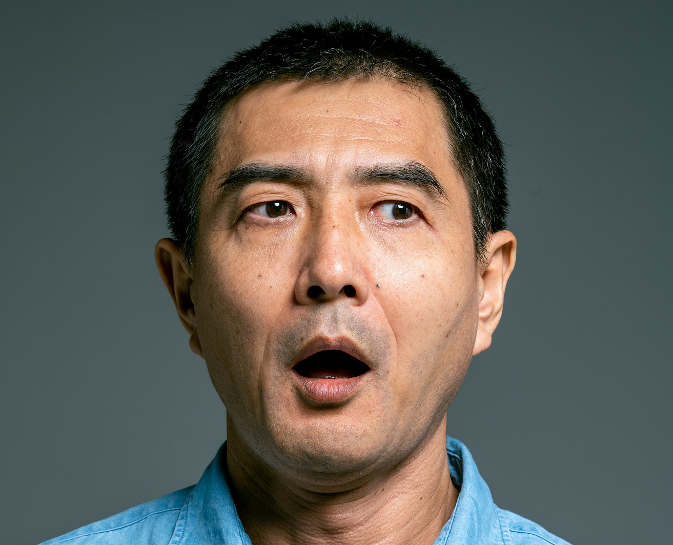 Surprised man is looking at side.