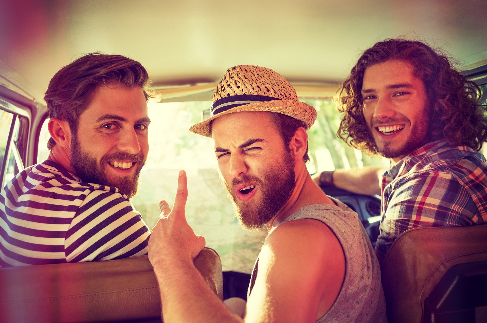 Hipster friends on road trip on a summers day