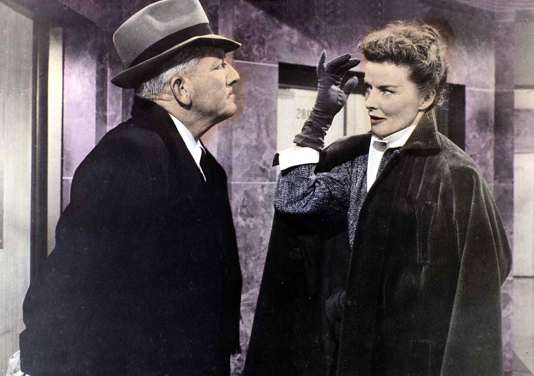 Spencer Tracy, Katharine Hepburn in front of an elevator
