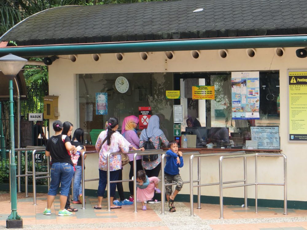 People  buying tickets