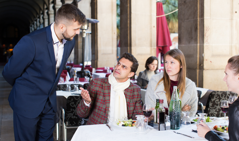 Couple angry at the waiter