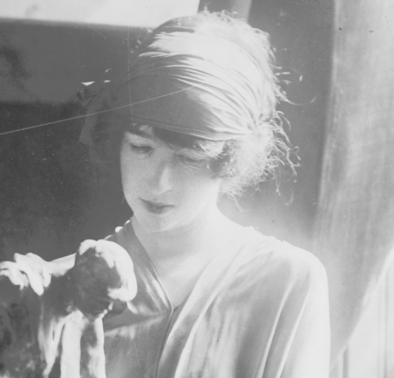 B&W photo of Gertrude Vanderbilt Whitney is making a sculpture in workshop - 1920