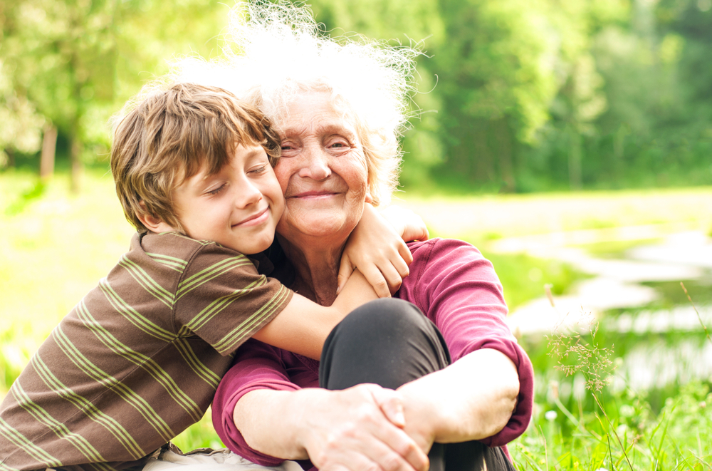 Grandson hugs his beloved grandmother