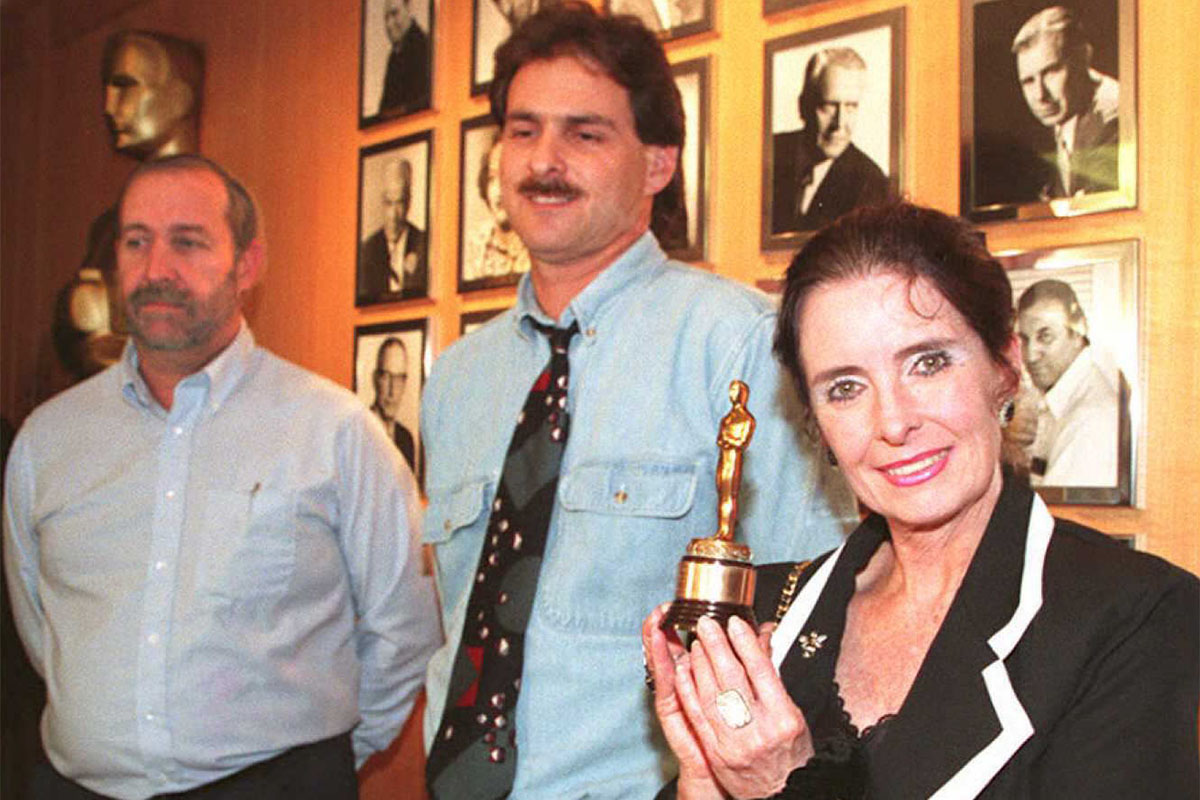Former child actress Margaret O'Brien (R) holds the Oscar she won as outstanding child actress at the 1944 Academy Awards after it was returned to her 07 February in Beverly Hills. Mark Nash (L) and Steve Neimand (C) recently found the Oscar at a flea market, ending O'Brien's search for the award, which was stolen from her 37 years ago.
