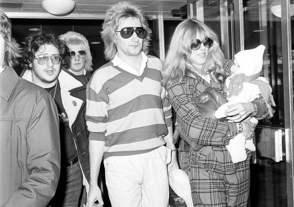 Rock star Rod Stewart and his wife Alana and baby Kimberly at Heathrow Airport in casual wear
