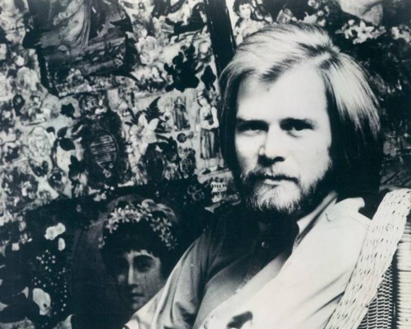 Long John Baldry portrait in shirt sitting on an armchair