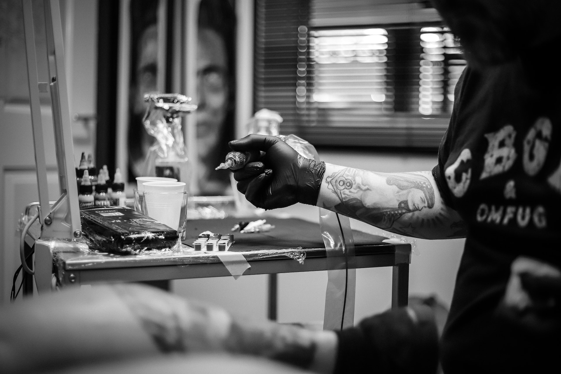 Black and white photography of a Tattoo artist