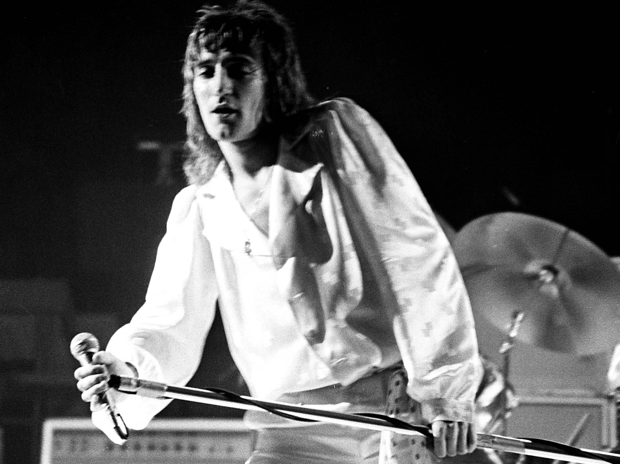 Rod Stewart performs with the band Faces at New York City's Madison Square Garden in white shirt