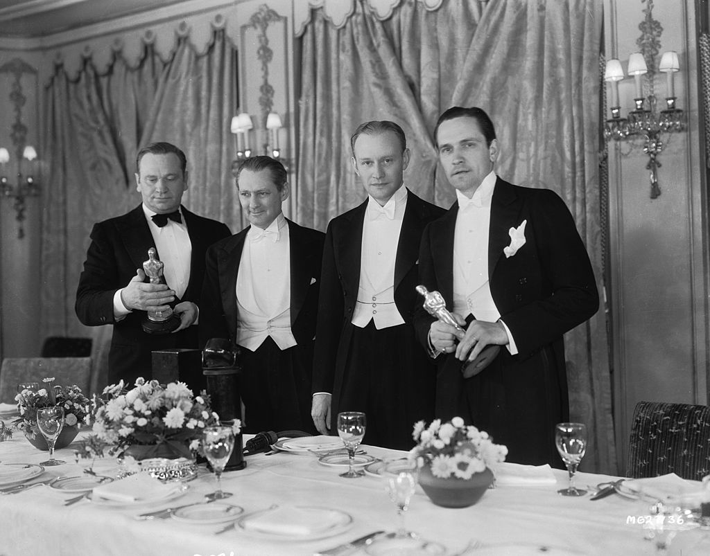 19th November 1932: From left to right, Wallace Beery (1885 - 1949), Lionel Barrymore (1878 - 1954), Conrad Nagel (1897 - 1970) and Fredric March (1897 - 1975) at the 1932 Academy Awards. Beery and March won the Best Actor Oscar jointly for their respective roles in 'The Champ' and 'Dr Jekyll and Mr Hyde'.