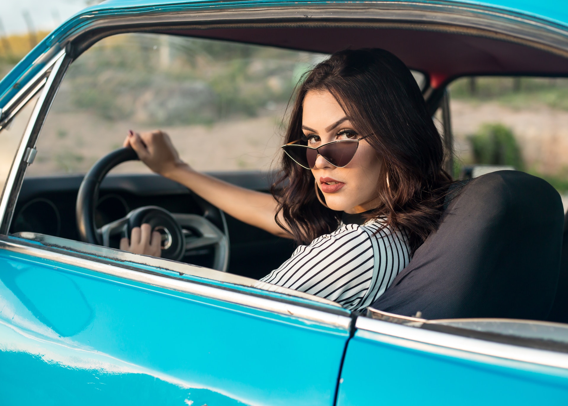 woman sitting in car driving