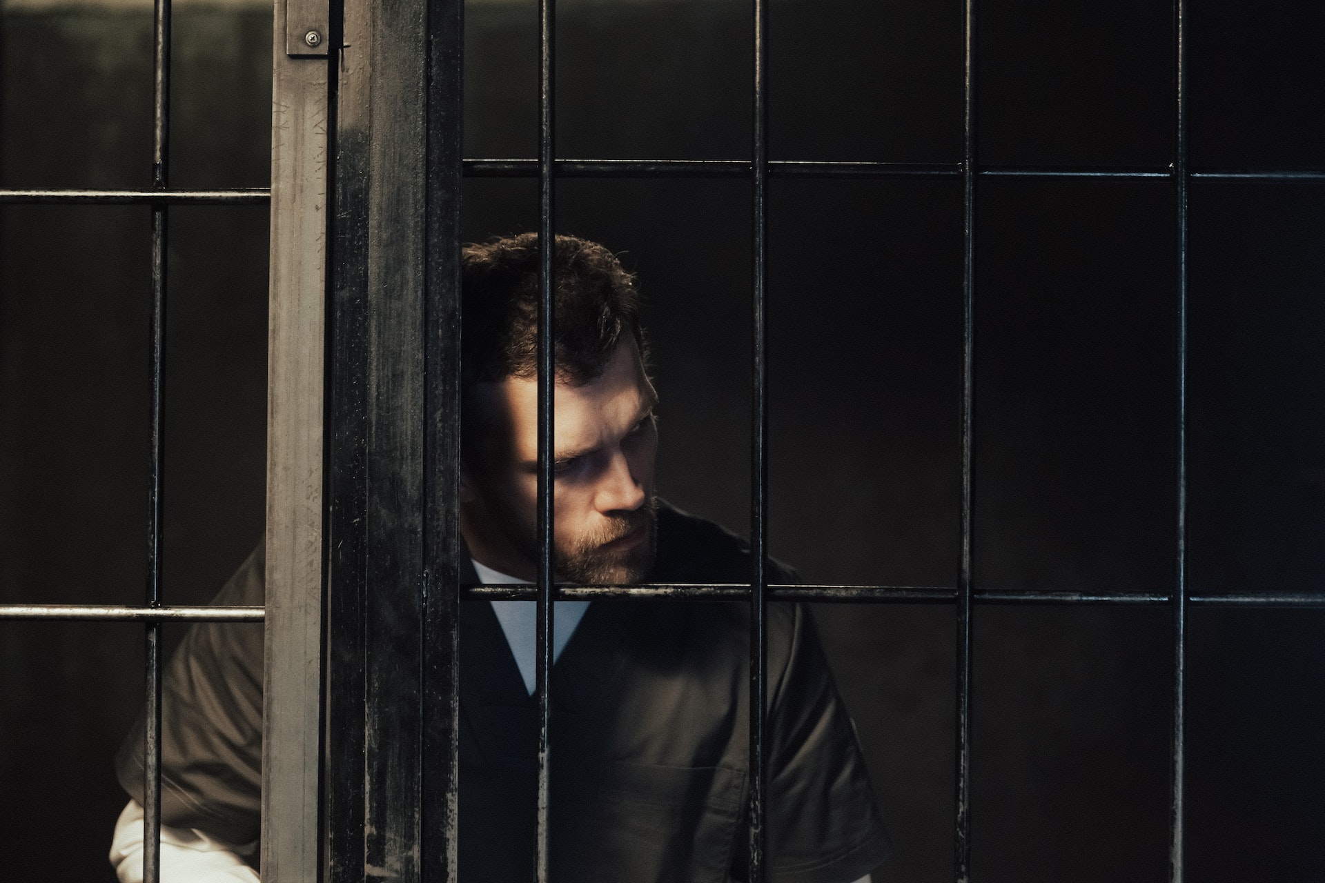 man in prison looking right