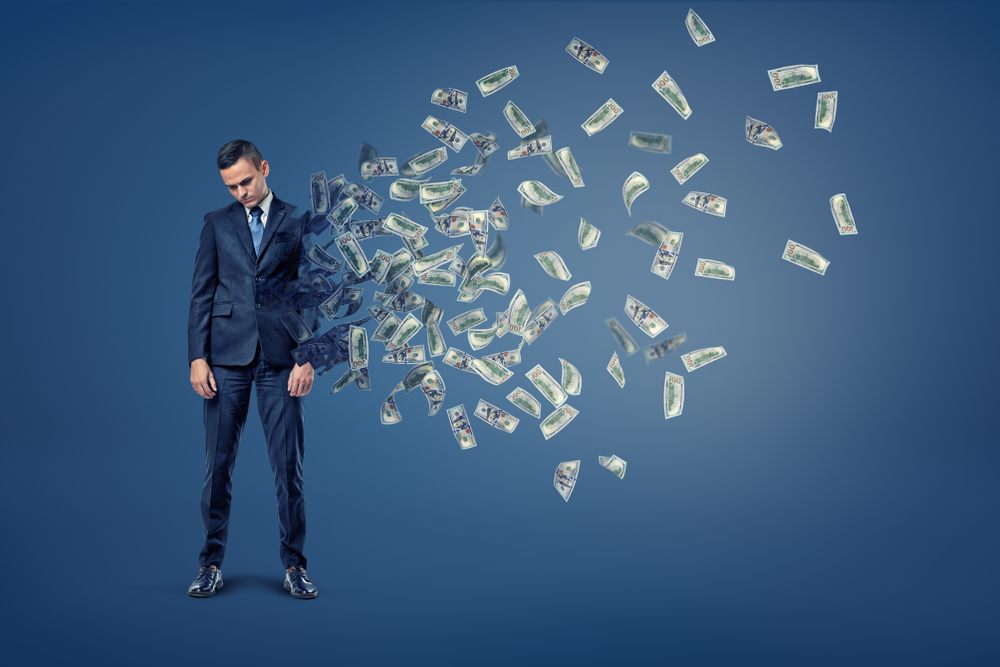 businessman losing money