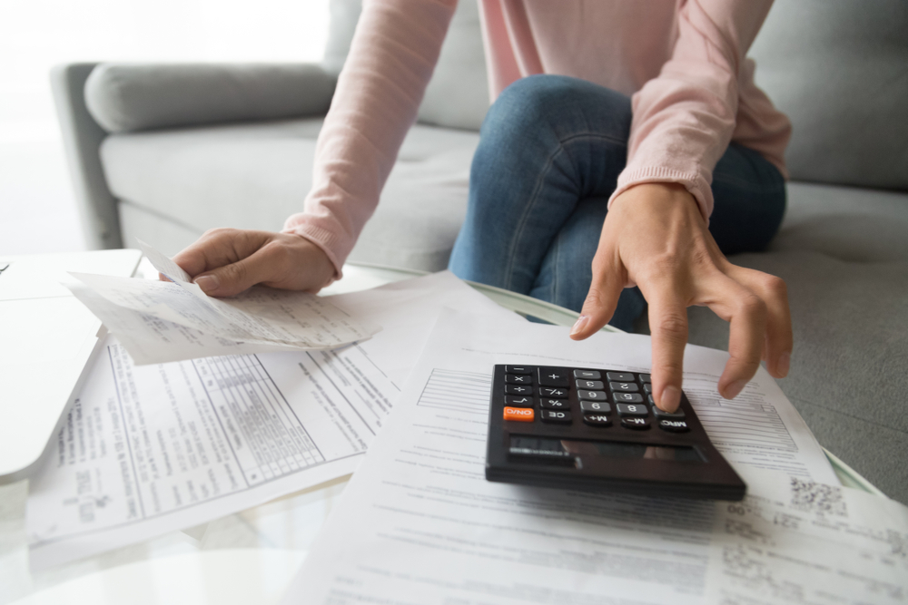 Woman checking her finances at home