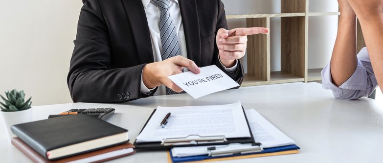 Business boss sending you're fired letter