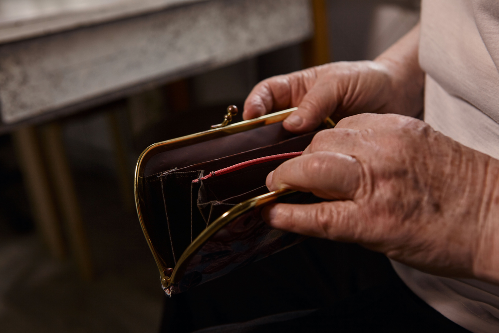 grandmother opens an empty wallet