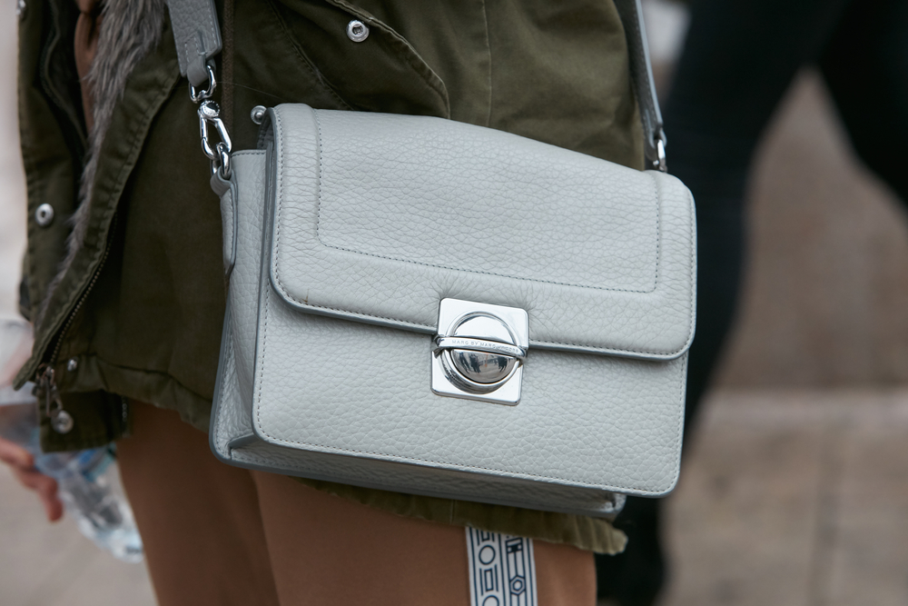 Woman with gray leather Marc Jacobs bag