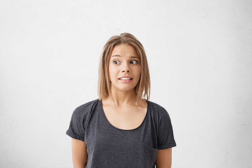 Headshot of funny girl with bob hairstyle looking away