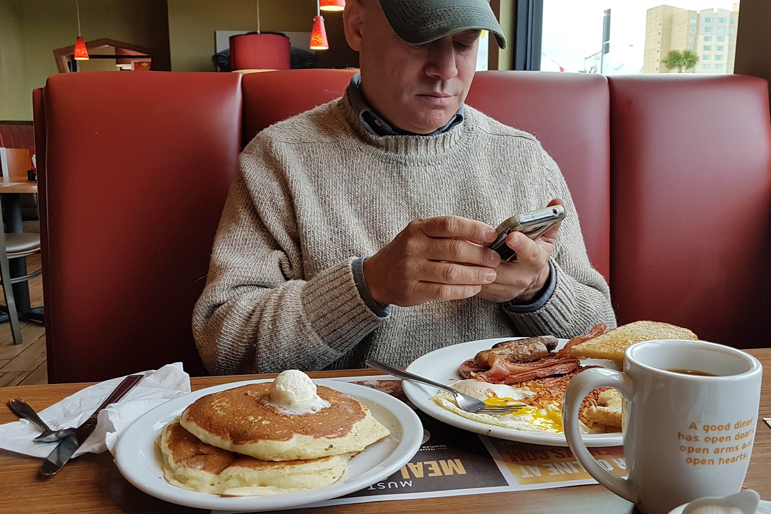 Man Eating At Denny's