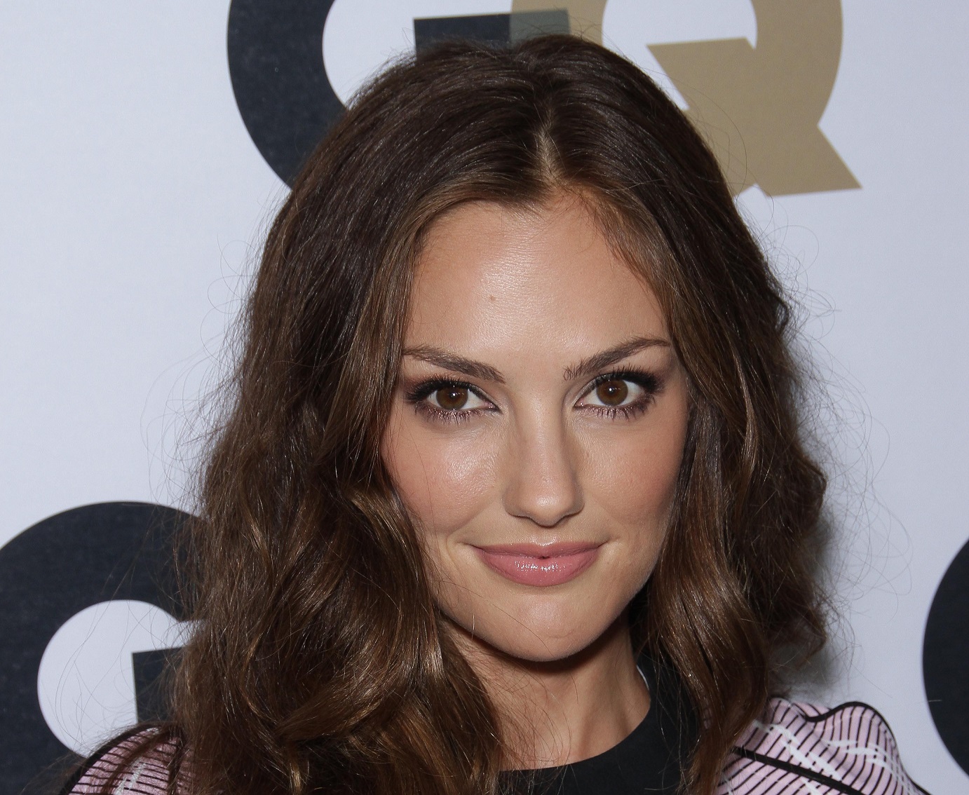Minka Kelly wearing b&w shirt is looking at camera - 2011