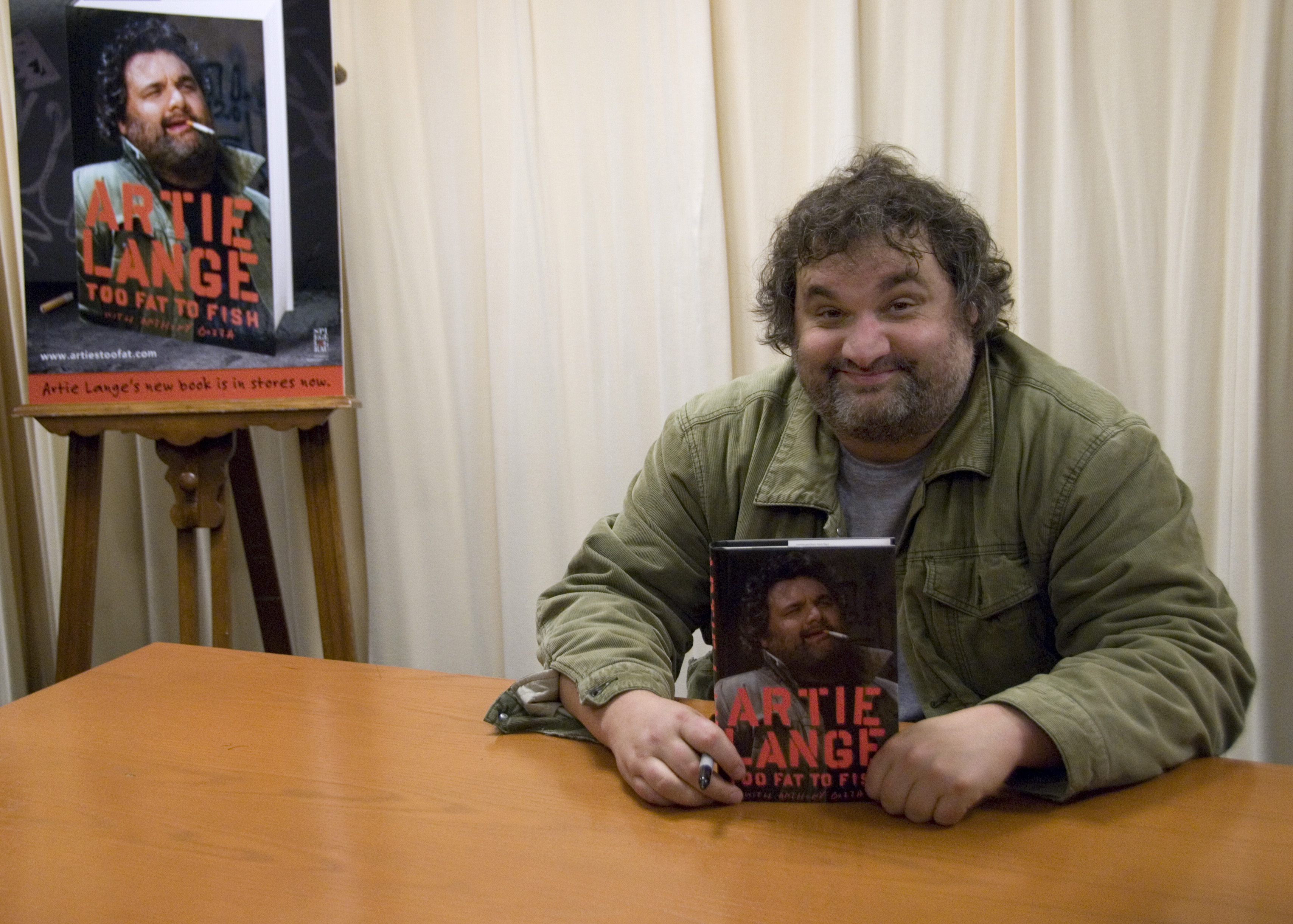 NEW YORK - NOVEMBER 11: Artie Lange of SIRIUS XM's Howard Stern Show signs copies of 