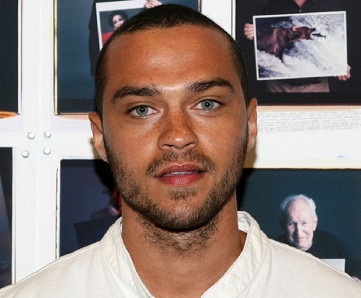 Jesse Williams wearing white shirt is looking and smiling at camera - 2008
