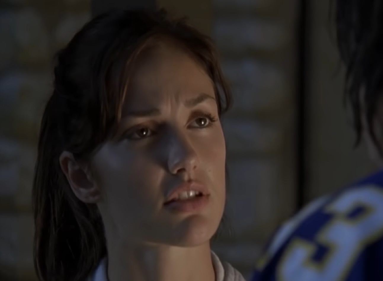 Screenshot: Minka Kelly is looking at side with sad face - from Friday Night Lights (2006-11)