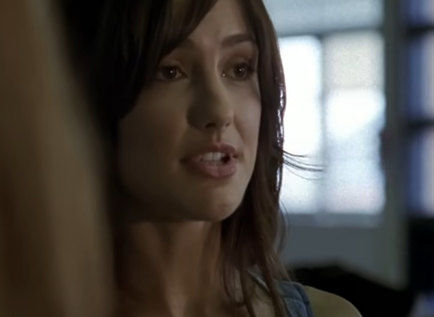 Screenshot: Minka Kelly wearing blue shirt is looking at side - from Friday Night Lights (2006-11)