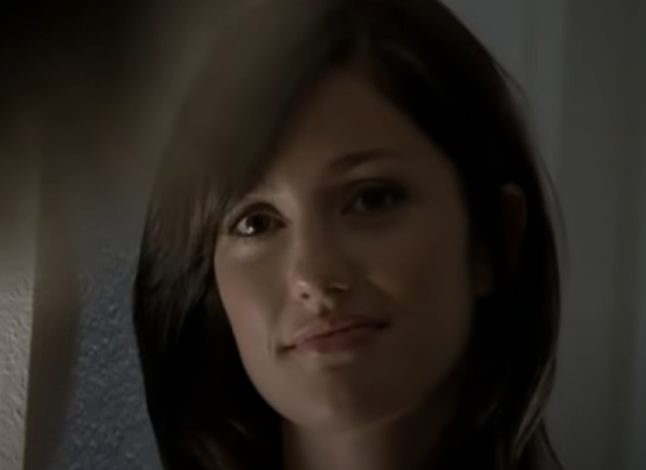 Screenshot: Minka Kelly is looking at front and smiling - from Friday Night Lights (2006-11)