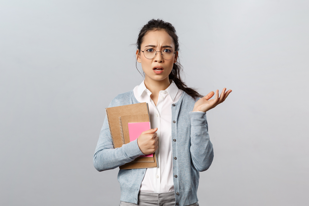 Frustrated, puzzled, and confused female tutor