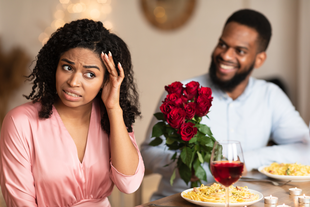 African American Couple Having Unsuccessful date In Restaurant