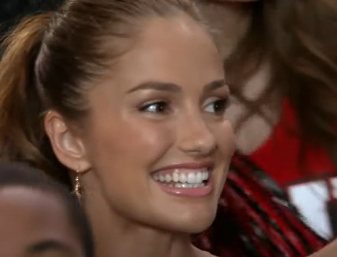 Screenshot: Minka Kelly looking at side and smiling - from Charlie's Angels (2011 TV series)