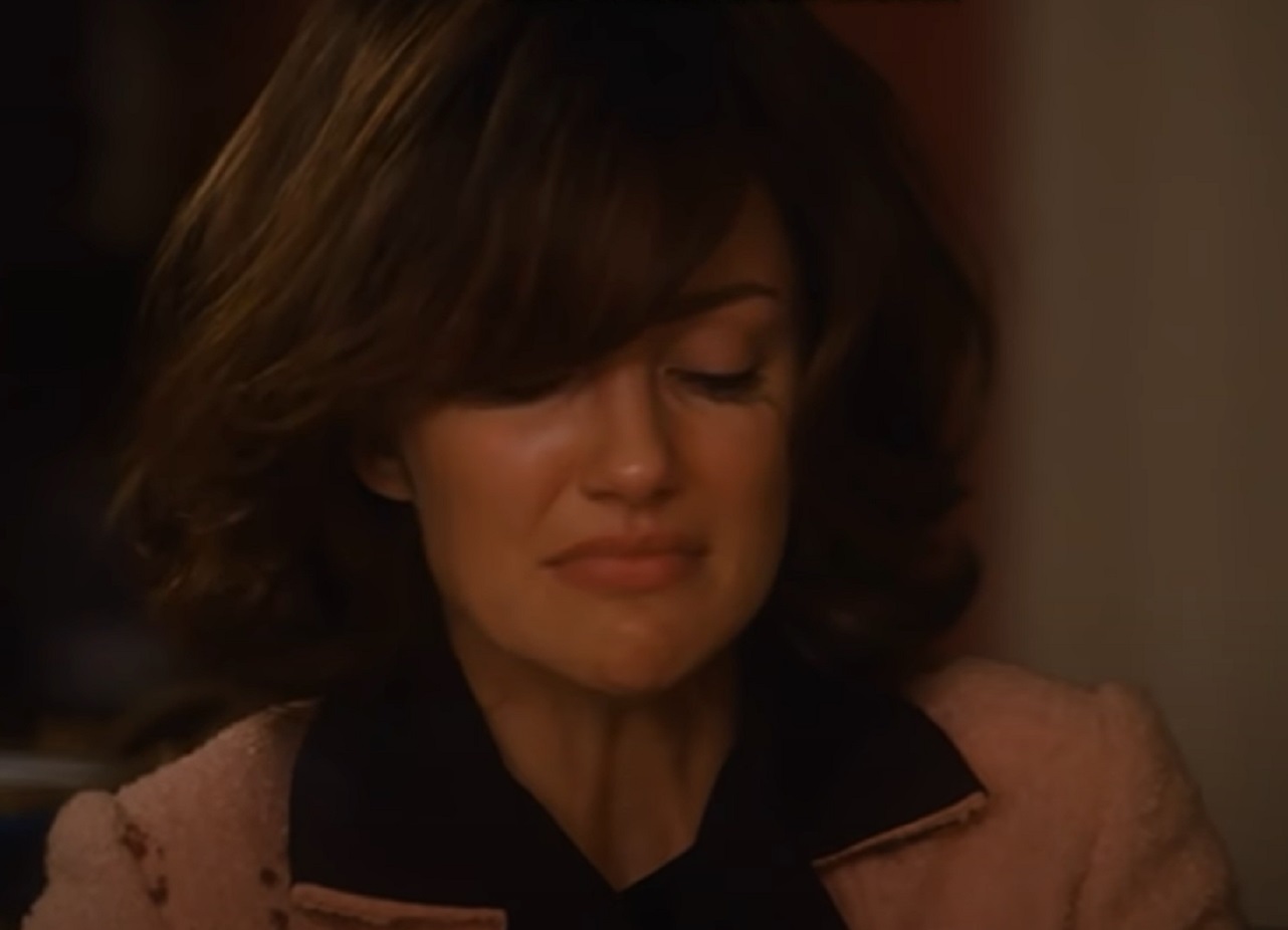 Screenshot: Minka Kelly wearing pink coat is looking down and crying - from The Butler (2013).