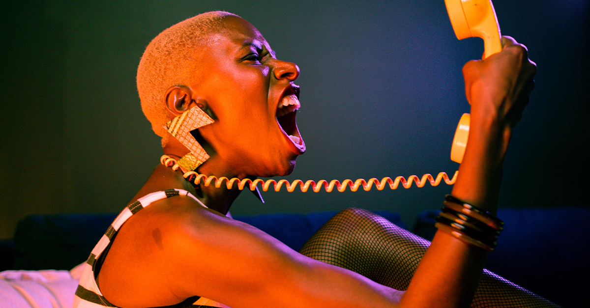 Portrait of Eccentric Woman Screaming at a Phone