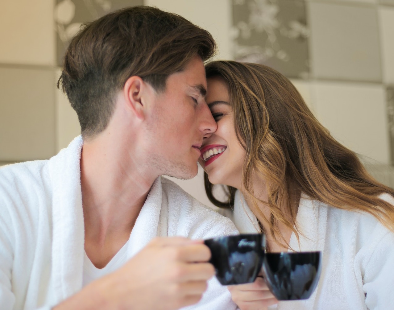 Young couple are talking and drinking coffee in the morning.