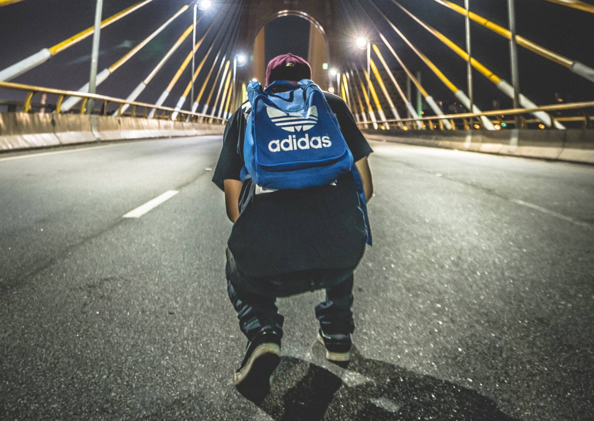 Man walking on a street at night