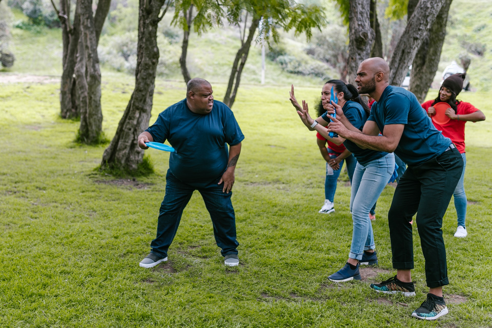 Group of people playing with frisbee