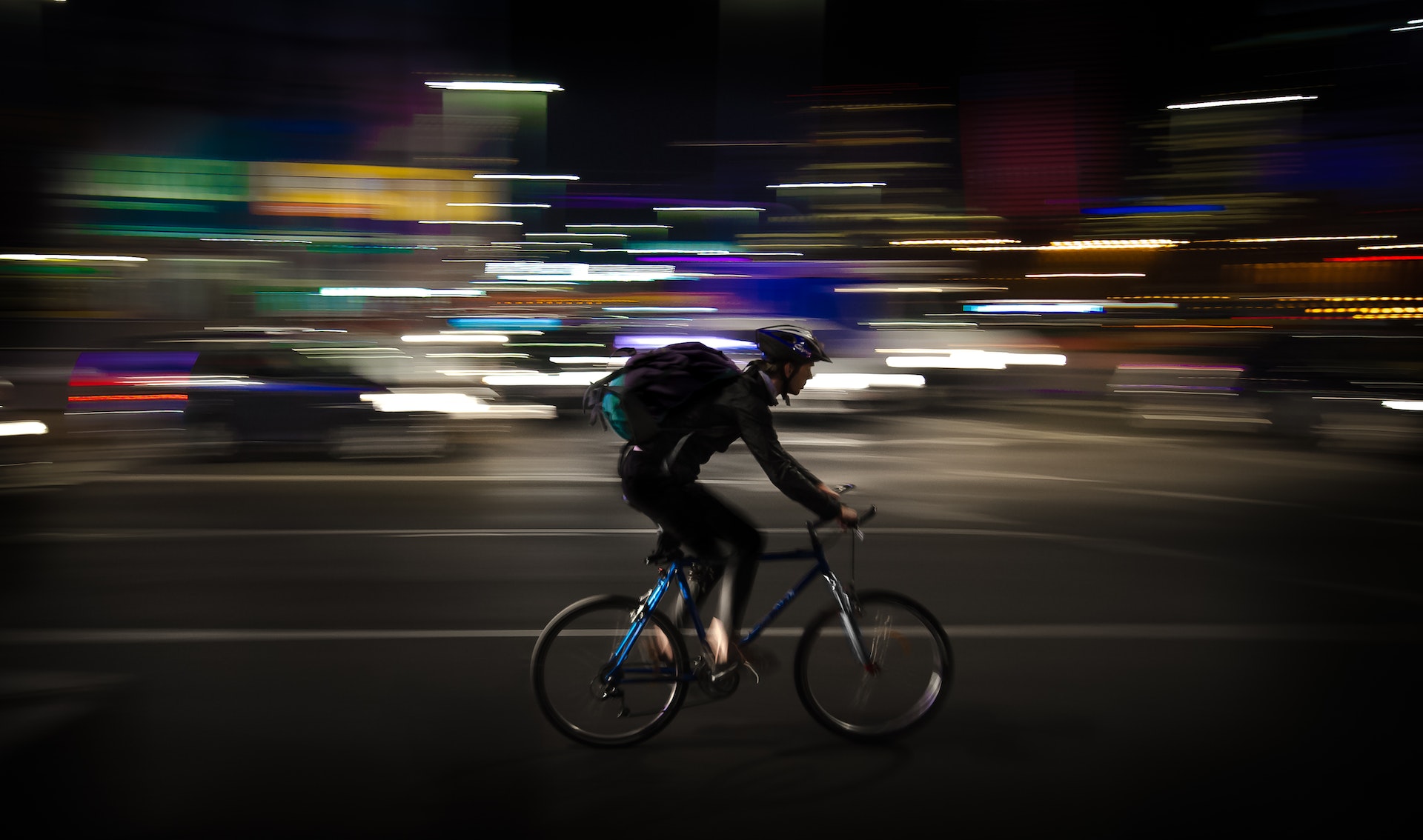 Man riding a bike at night