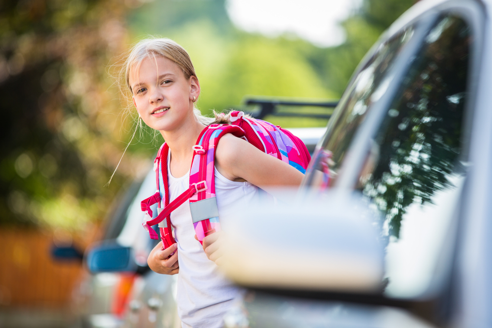 Cute little girl going home from school