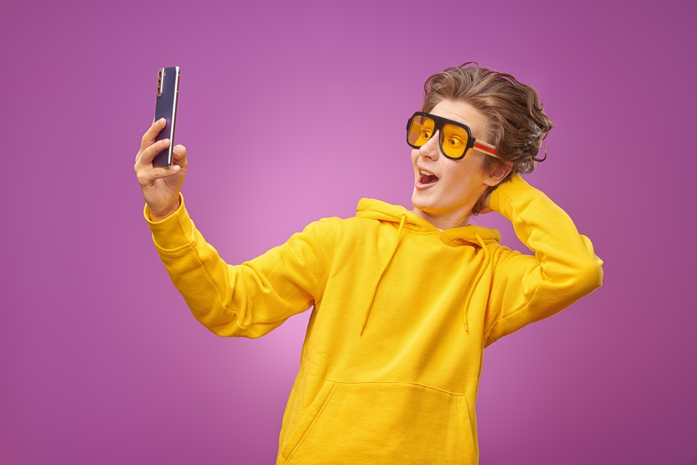 Teenager  talking via video call or making a video