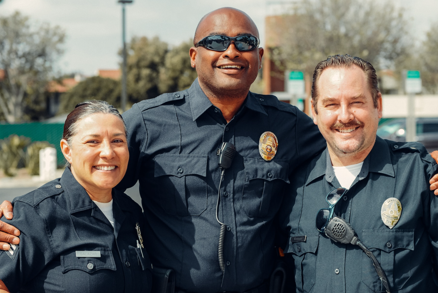 Three Police Officers in Blue Uniform