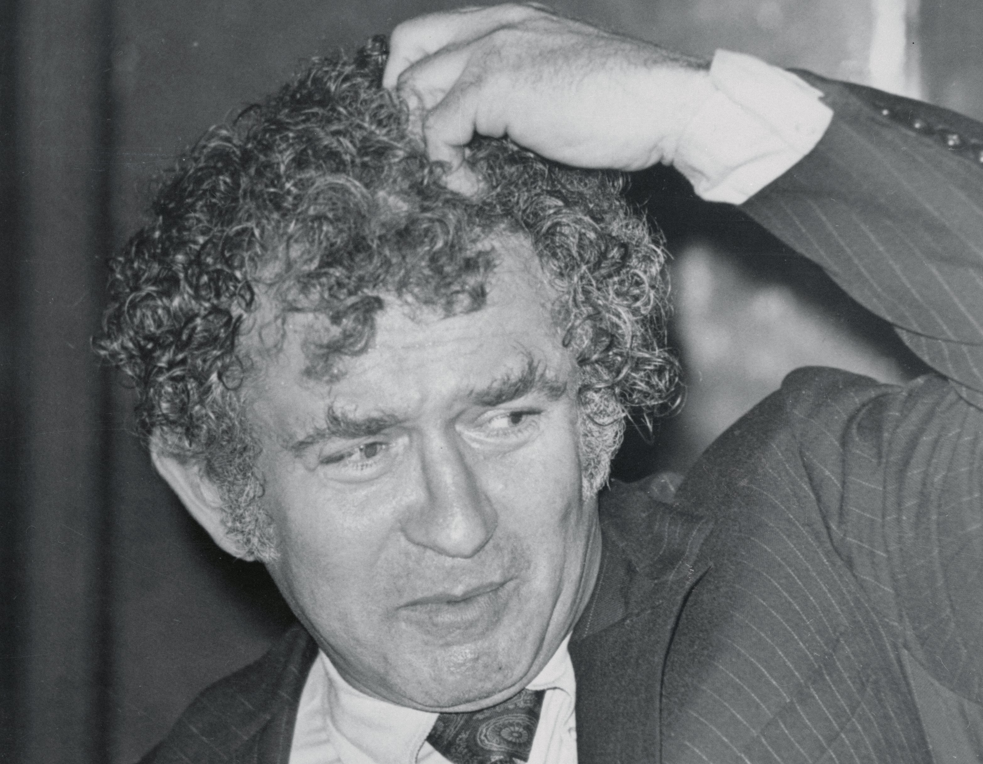Norman Mailer Scratching His Head
