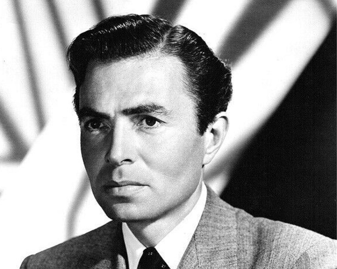 B&W photo of James Mason wearing grey suit and looking at side - circa 1940