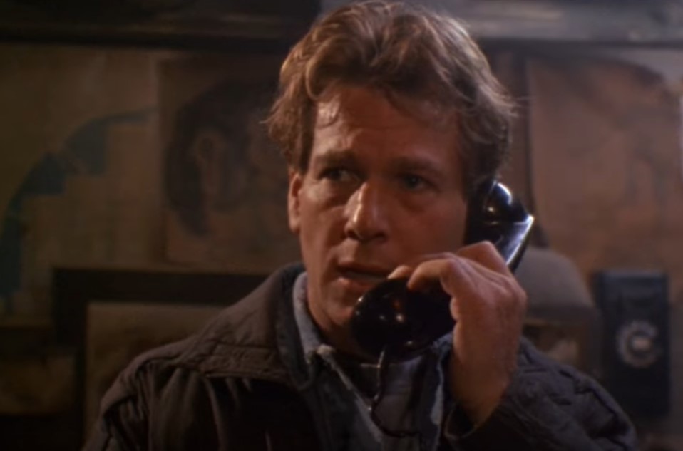 Ryan O'Neal as  Tim Madden looking at the camera