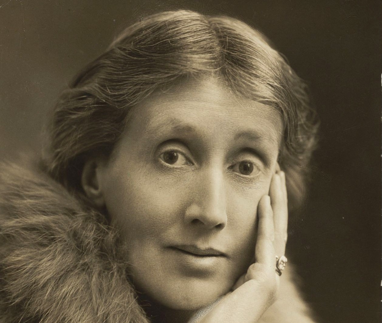 Virginia Woolf with hand on face wearing a fur stole - circa 1927