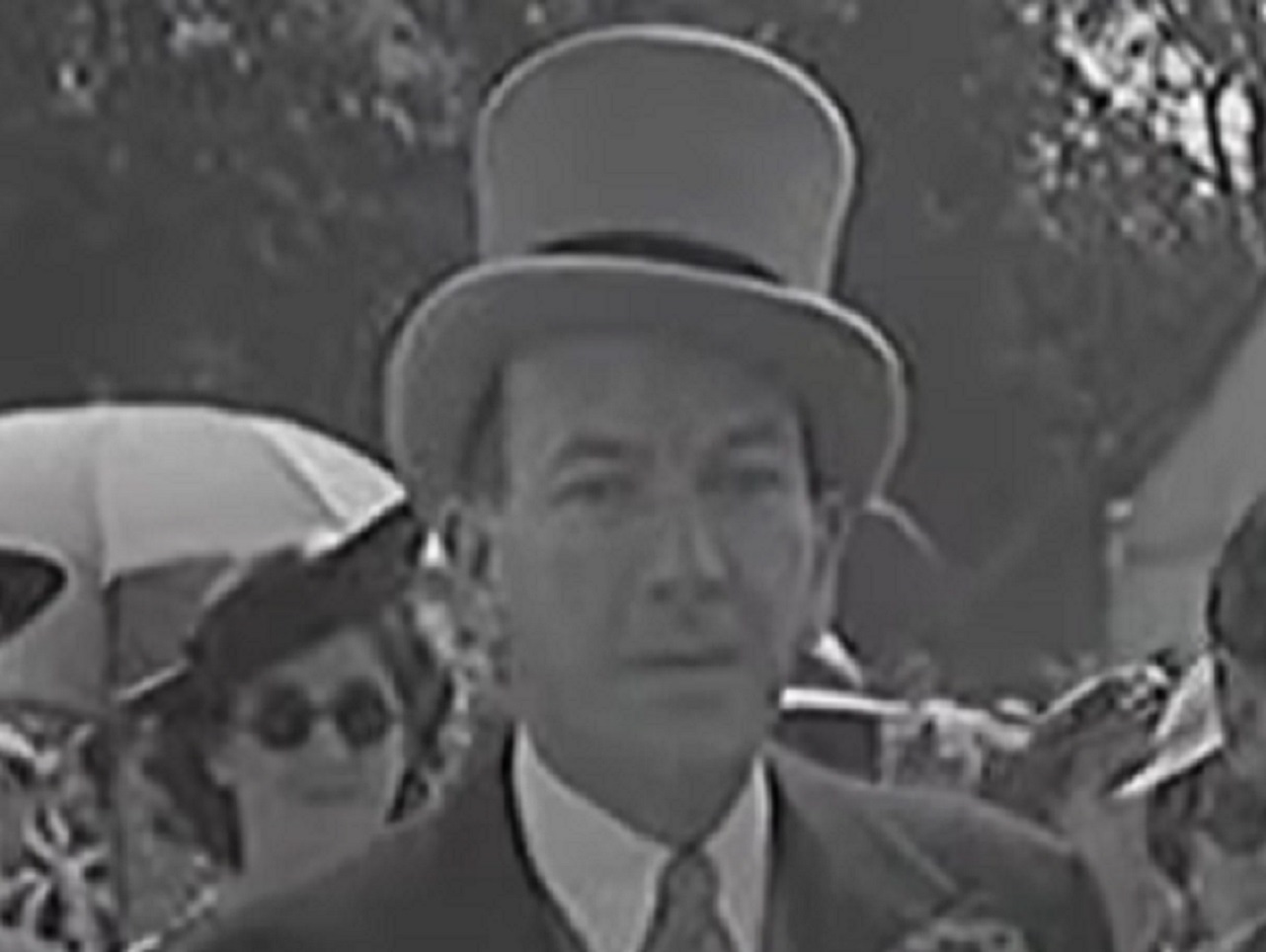 B&W Screenshot: Noel Coward with cylinder hat on his head - from Mad About the Boy: The Noel Coward Story (2023)