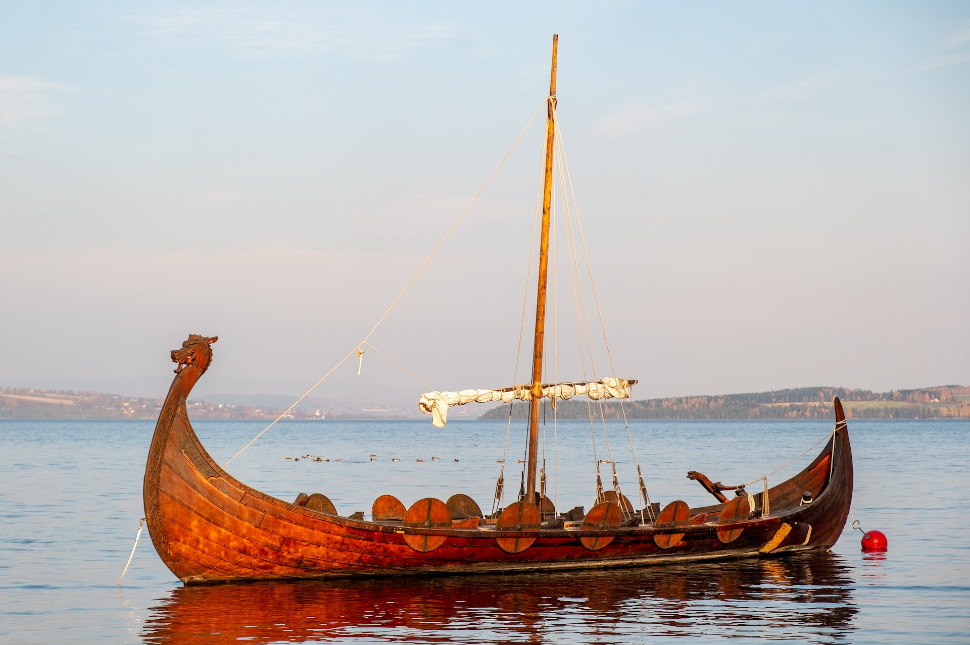 Close-up of a Viking ship on a clear blue sea and blue sky background