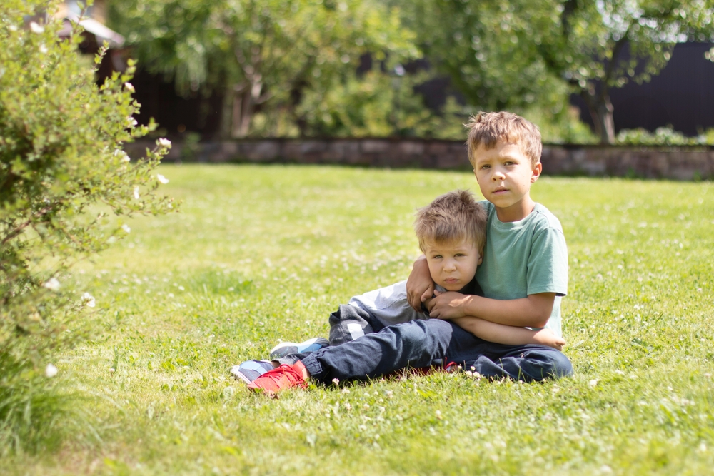 Hands igniting match on a black background.