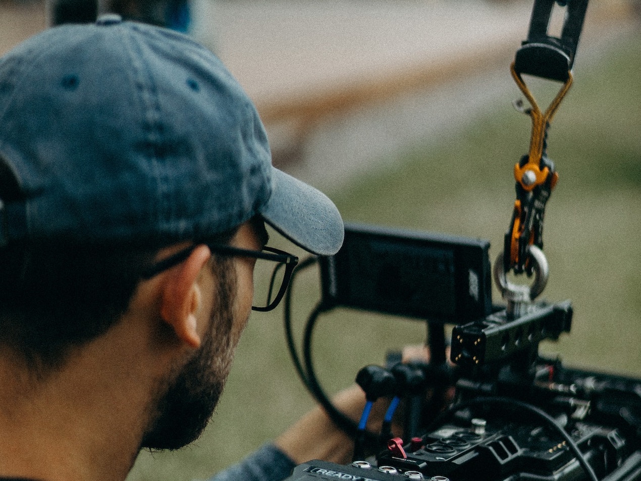Man is filming a video with digital camera on the set.