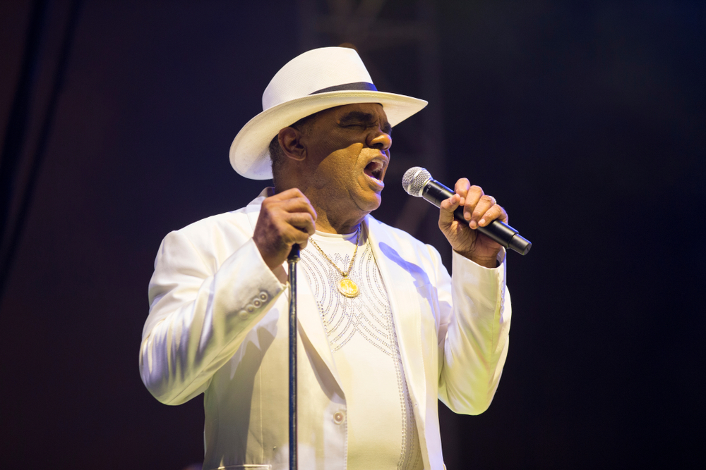 Whitney Houston wearing white dress is performing live - 1991